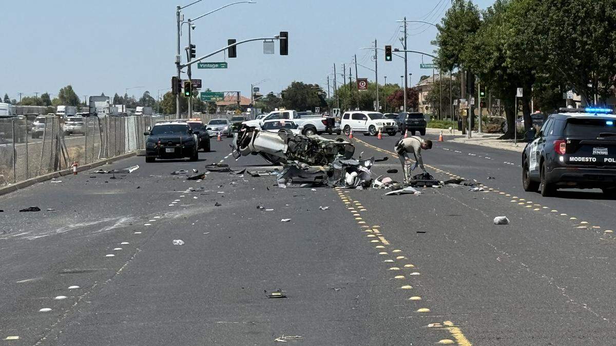 A Chevrolet Corvette lies upside down on Sisk Road in Modesto after crashing during a race on Highway 99.