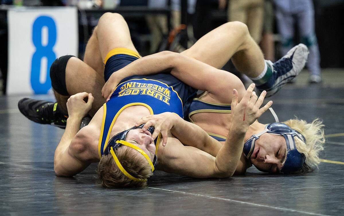 Turlock’s Logan Ladd, left, and Jonathan Crespin of Gregori battle in the 152-pound fifth-place match during the CIF Sac-Joaquin Section Masters Wrestling Tournament at the Stockton Arena in Stockton, Calif., on Saturday, Feb. 19, 2022. Crespin won the match with a pin of Ladd.