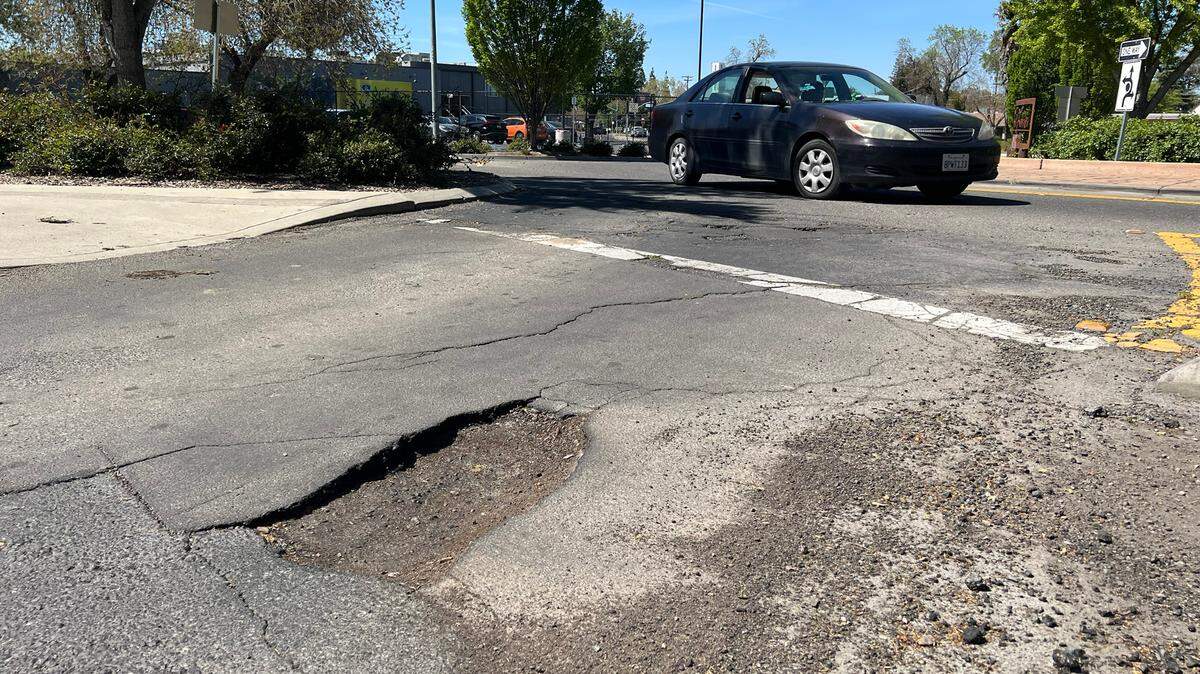 A large pothole on James Street in Modesto, Calif., Thursday, April 13, 2023.