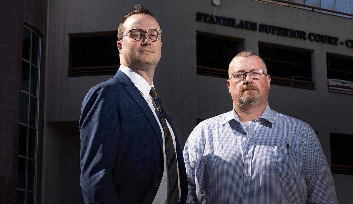 Joey Christiansen, right, with his lawyer Wes Griffith in Modesto on Tuesday, Oct. 29, 2024. Christiansen, a former Save Mart store director, is suing the company for wage theft.