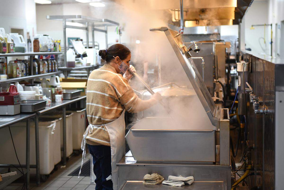 Denise Barker prepares food at Howard Prep in Ceres, Calif., Wednesday, Feb. 21, 2023.