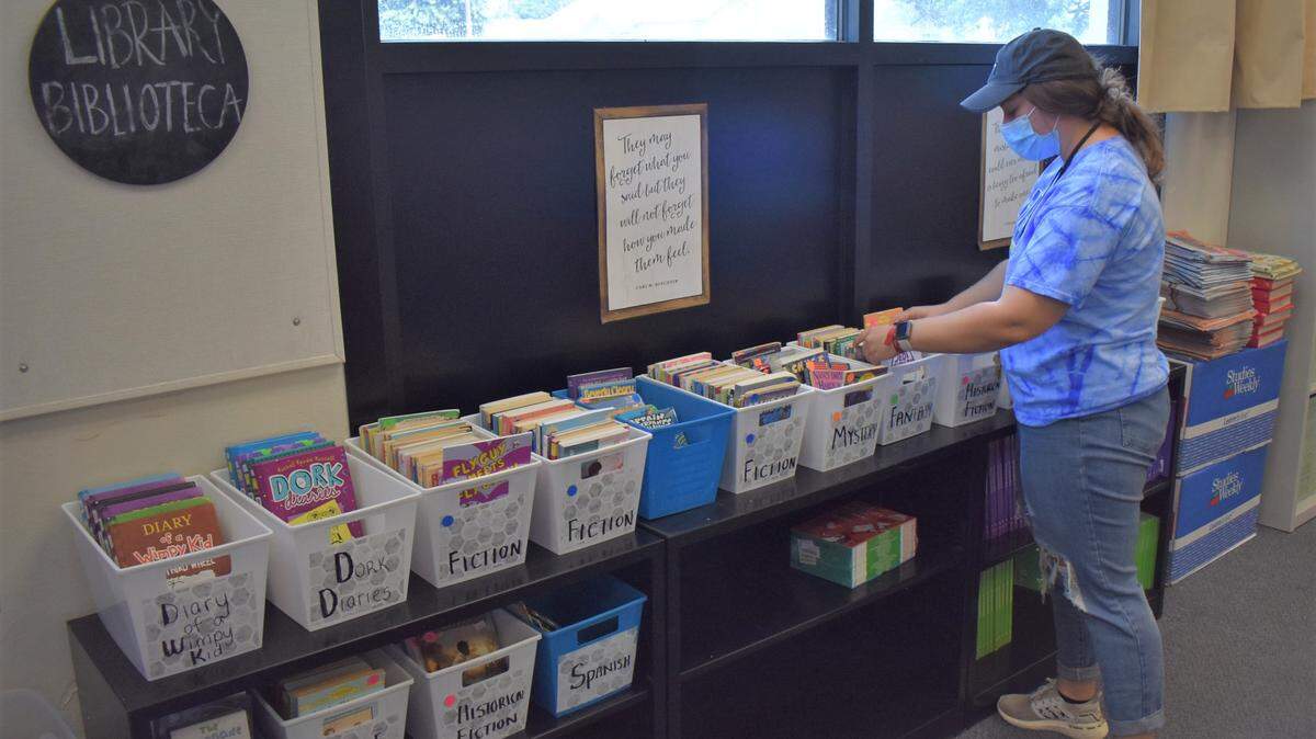Taylor Maddox, who teaches a fourth/fifth-grade combination class, works in her classroom Monday, Aug. 2, 2021, in preparation for students’ return to campus Aug. 9.