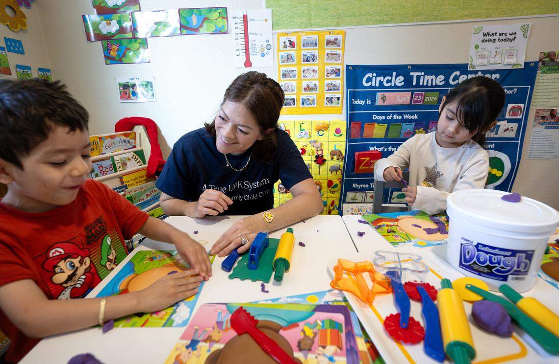 Childcare provider Adriana Segura works on art projects with her son Alexander Padilla, 4, left, and Jazmine Rodriguez, 4, at her at-home daycare in Patterson on Friday, April 24, 2026.