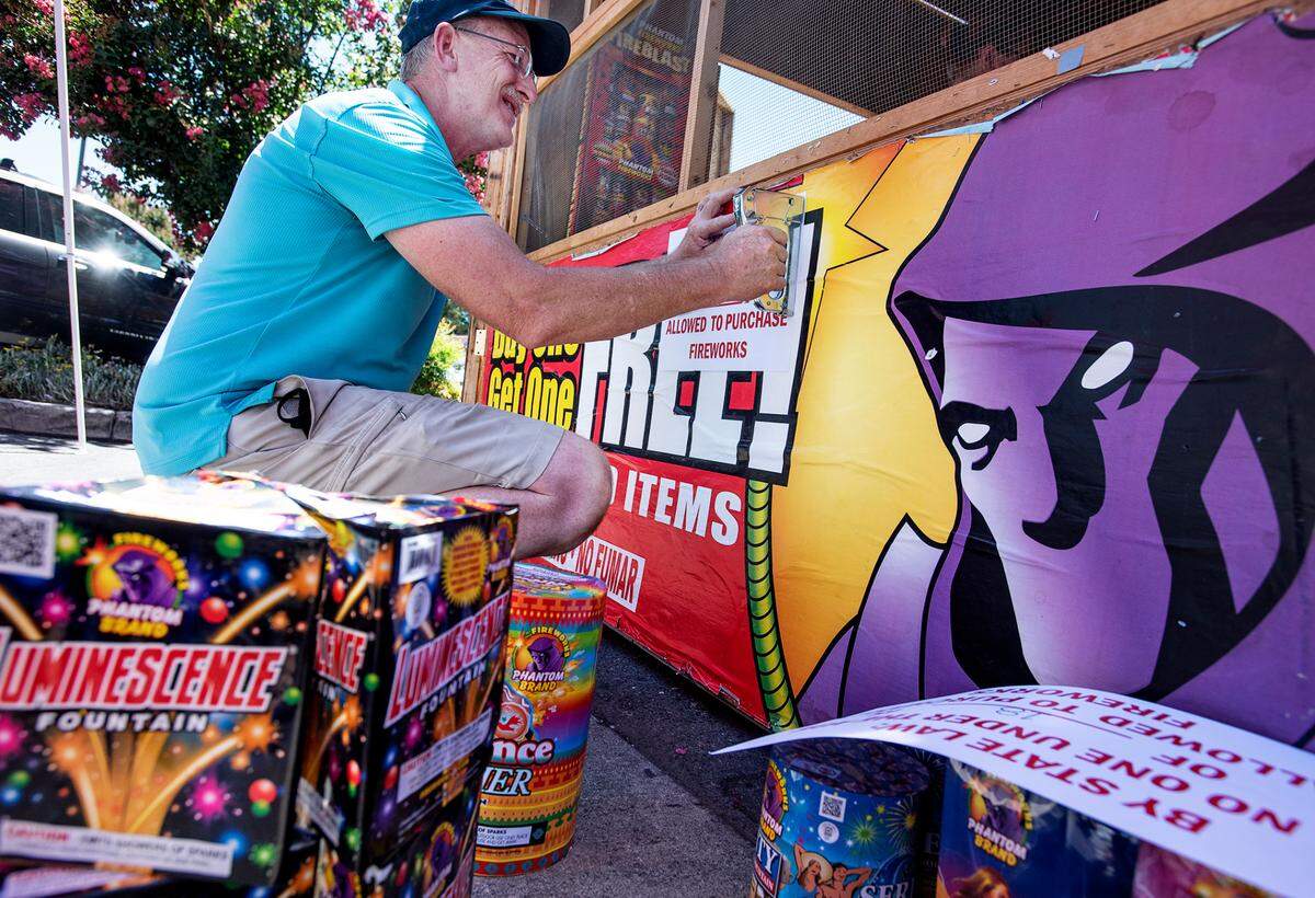 Greg Hazenberg and other members of Modesto Foursquare Church set up a fireworks booth at a shopping center on Prescott Road and Stanford Avenue in Modesto, Calif., on Tuesday, June 30, 2020.