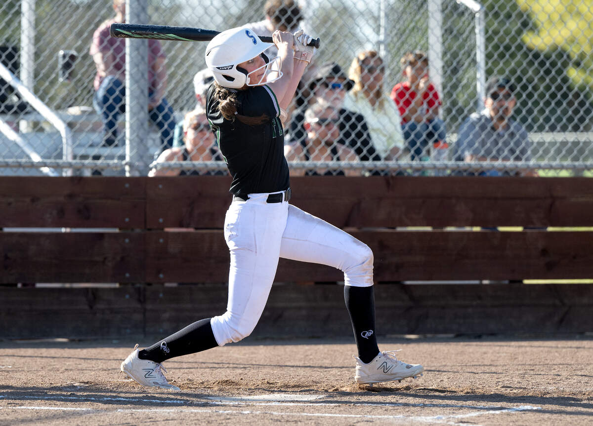 Pitman’s Rylee Reeves drives the ball for a triple during the Central California Athletic League game with Downey at Pitman High School in Turlock, Calif., Tuesday, March 19, 2024.