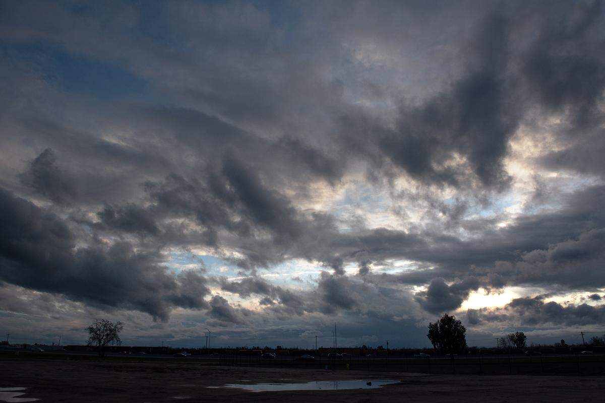 Storm Clouds pass through Ceres, Calif., Friday, Jan. 13, 2023.