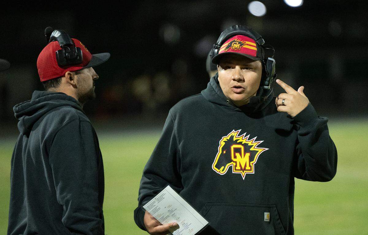 Oakdale head coach Garrett Martin on the sideline during the Valley Oak League game with Manteca at Manteca High School in Manteca, Friday, Nov. 1, 2024.