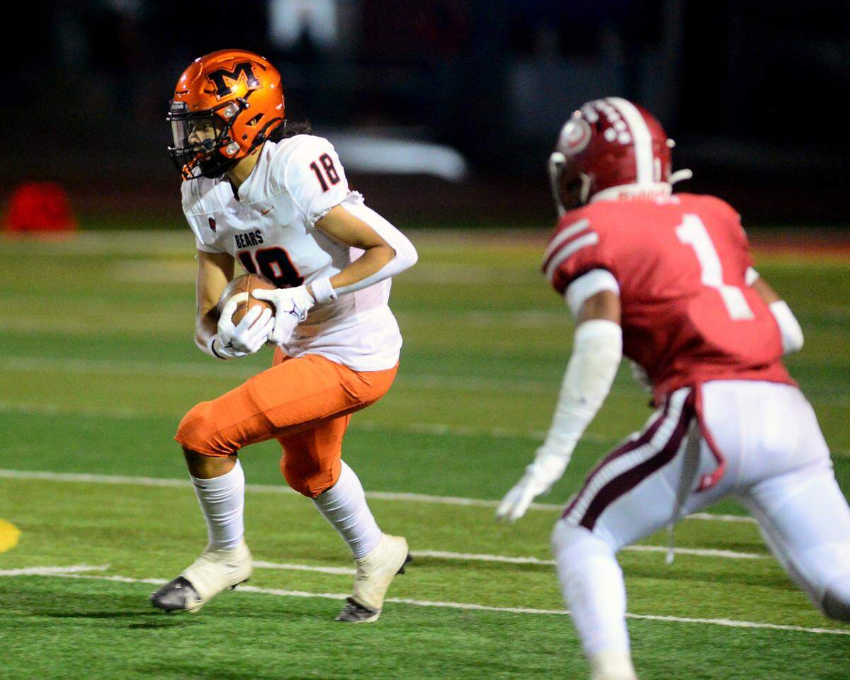 Merced receiver Jeremy Garcia catches a pass on a screen play during a game between Patterson and Merced at Patterson High School in Patterson California on September 29, 2023.