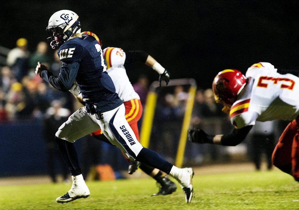 Central Catholic's Justin Rice breaks away for a touchdown during the Valley Oak League game with Oakdale at Central Catholic High School in Modesto, Calif., on Friday, Nov. 6, 2015.