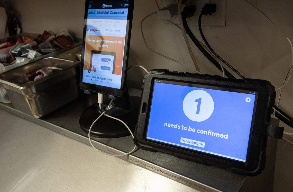 GrubHub and Doordash food delivery tablets at My Garden Cafe in Modesto, Calif., on Friday, May 13, 2022.