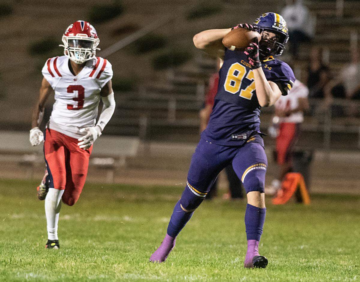 Escalon’s Ryan Lewis beats Modesto Christian’s defender Isaiah Davis and makes a catch and touchdown during the Trans-Valley League game in Escalon, Calif., Thursday, Oct. 6, 2022.