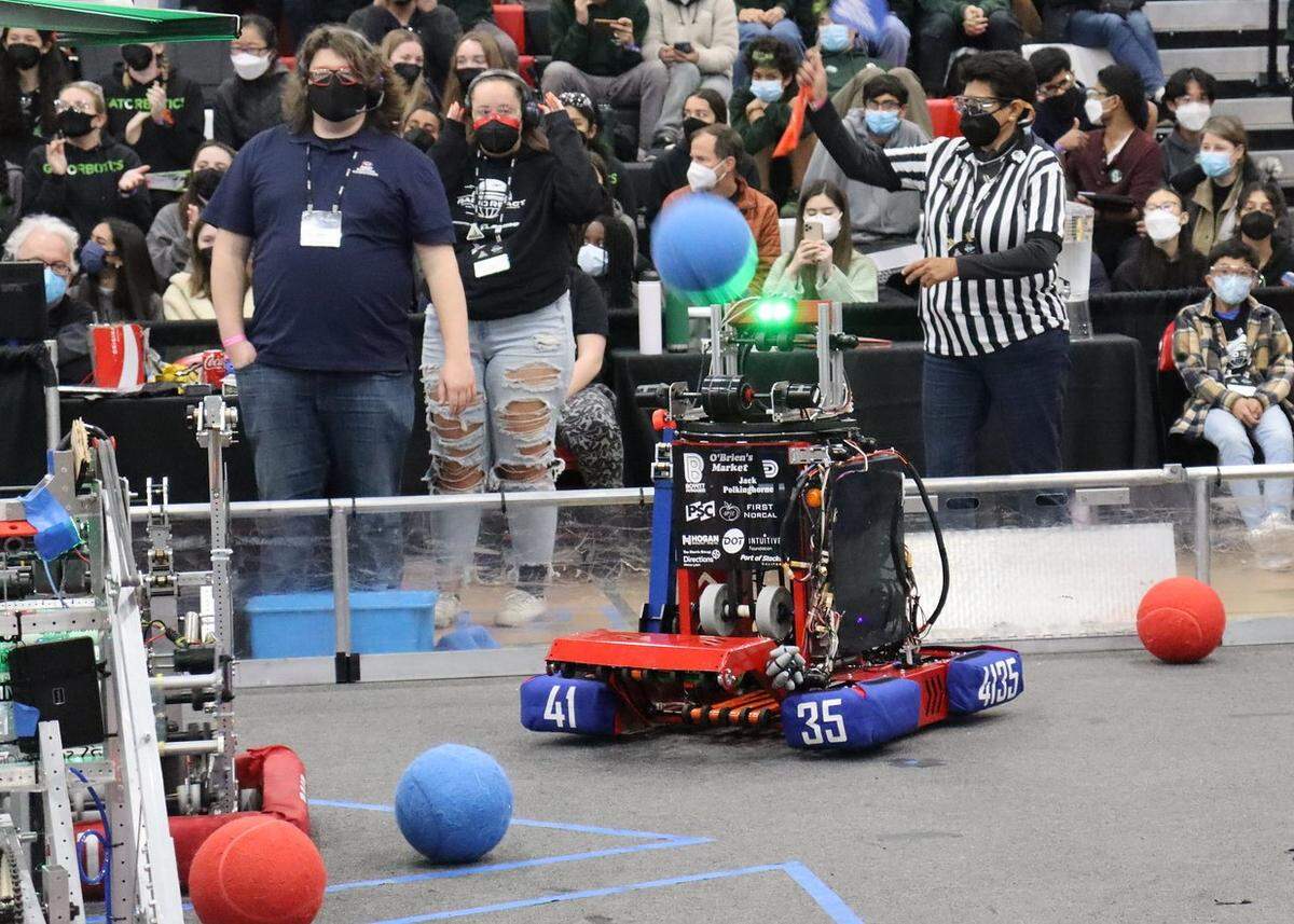 Iron Patriots’ robot “Iron X” shoots and scores at a regional competition in Monterey.