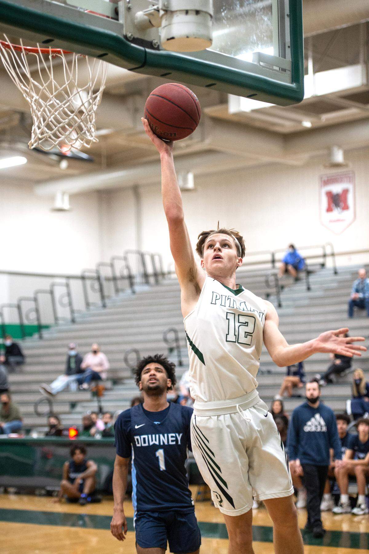 Pitman’s Seth Vink scores on a layup during the Central California Athletic League game with Downey at Pitman High School in Turlock, Calif., on Friday, Feb. 4, 2022.