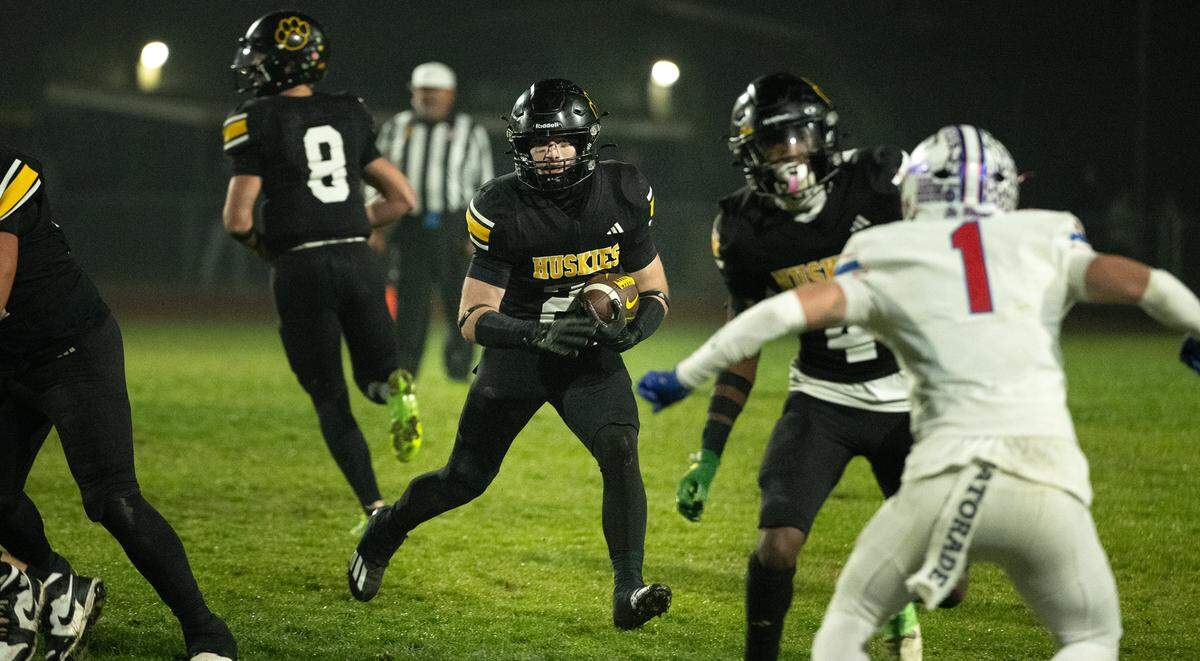 Hughson’s Eli Wilbanks runs the ball during the CIF Northern California Division 4-AA Bowl Game with St. Vincent de Paul in Hughson, Friday, Dec. 6, 2024.