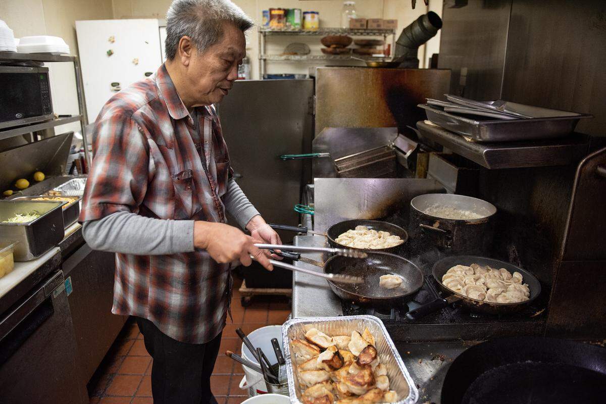 Owner and chef Benny Wong prepares potsticker dumplings at Beijing Restaurant in Modesto, Calif., Thursday, Dec. 15, 2022.
