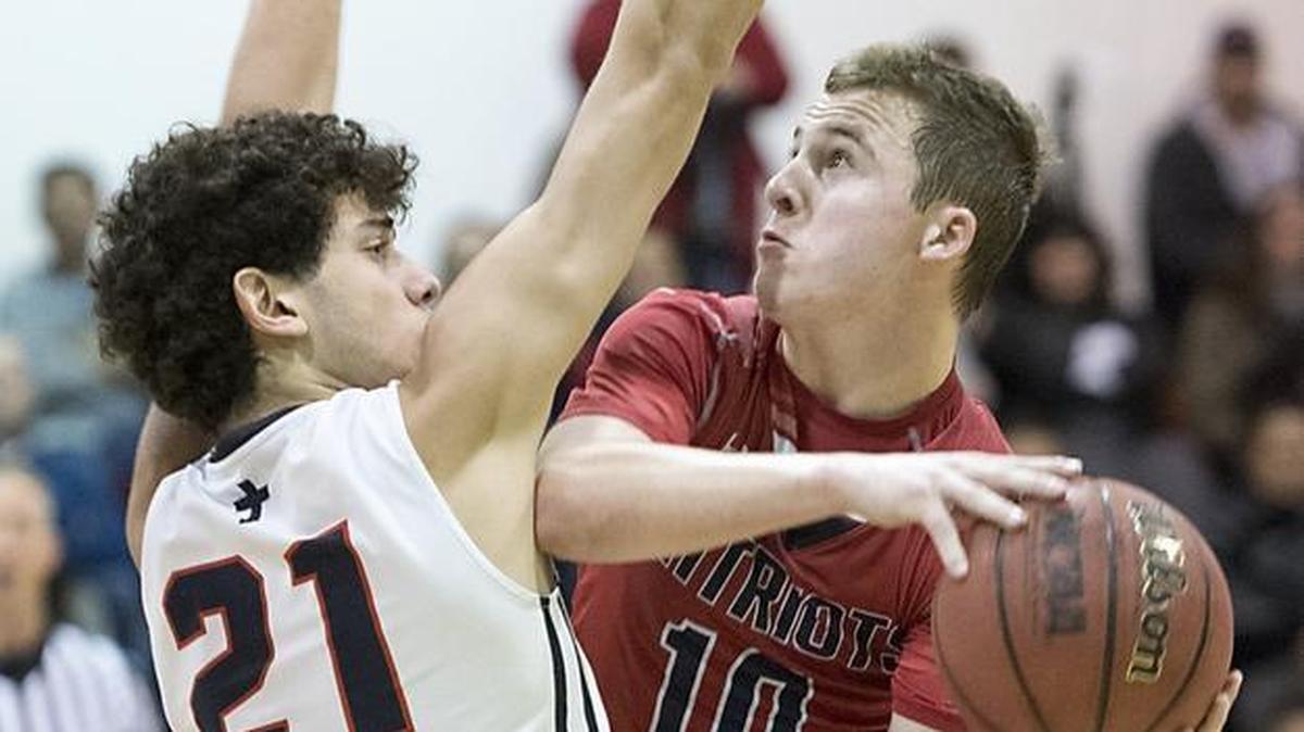 Beyer's Ben Polack attempts a shot on Modesto Christian's Tsotne Tsardsidse during the Modesto Metro Conference game with Modesto Christian in Salida on Wednesday, Jan. 24, 2018.