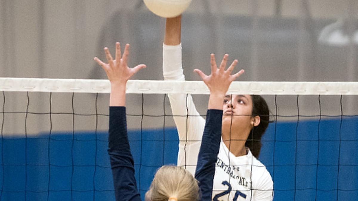 Central Catholic’s Abby Castillon spikes the ball past Gregori’s Fiona Currie during the match with Gregori in Salida, Calif., Tuesday, August 21, 2018.