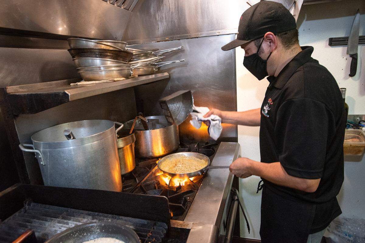Chef Sergio Alonso prepares dinners at L’ Gusto Cucina Italiana in Riverbank, Calif., on Wednsday, July 21, 2021.