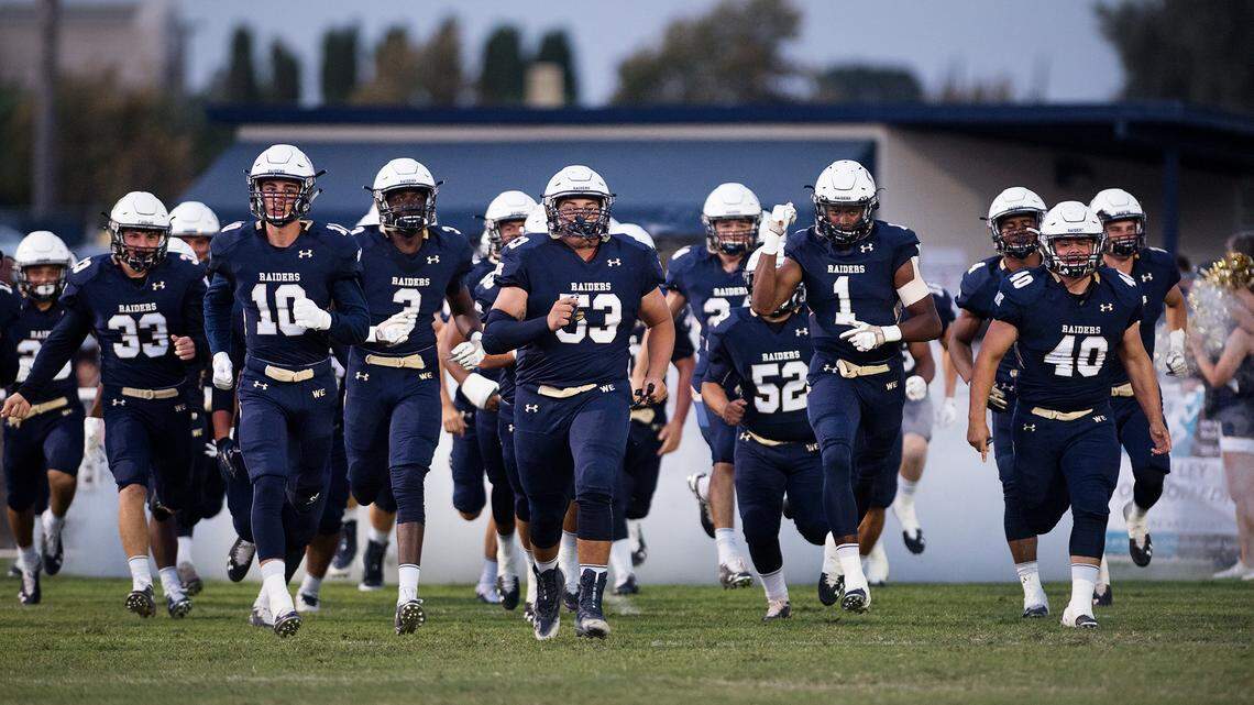 Central Catholic players take the field before the Holy Bowl game with St. Mary’s at Central Catholic High School in Modesto , Calif., August 31, 2018. 