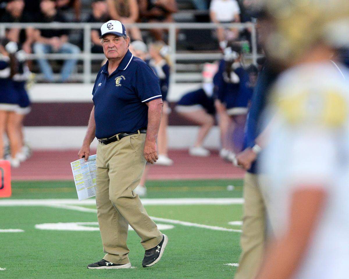 Central Catholic Head Coach Roger Canepa watches his team warm up before a game between Central Catholic High School and Patterson High School at Patterson High School in Patterson California on September 9, 2024. Central Catholic won the game 25-14