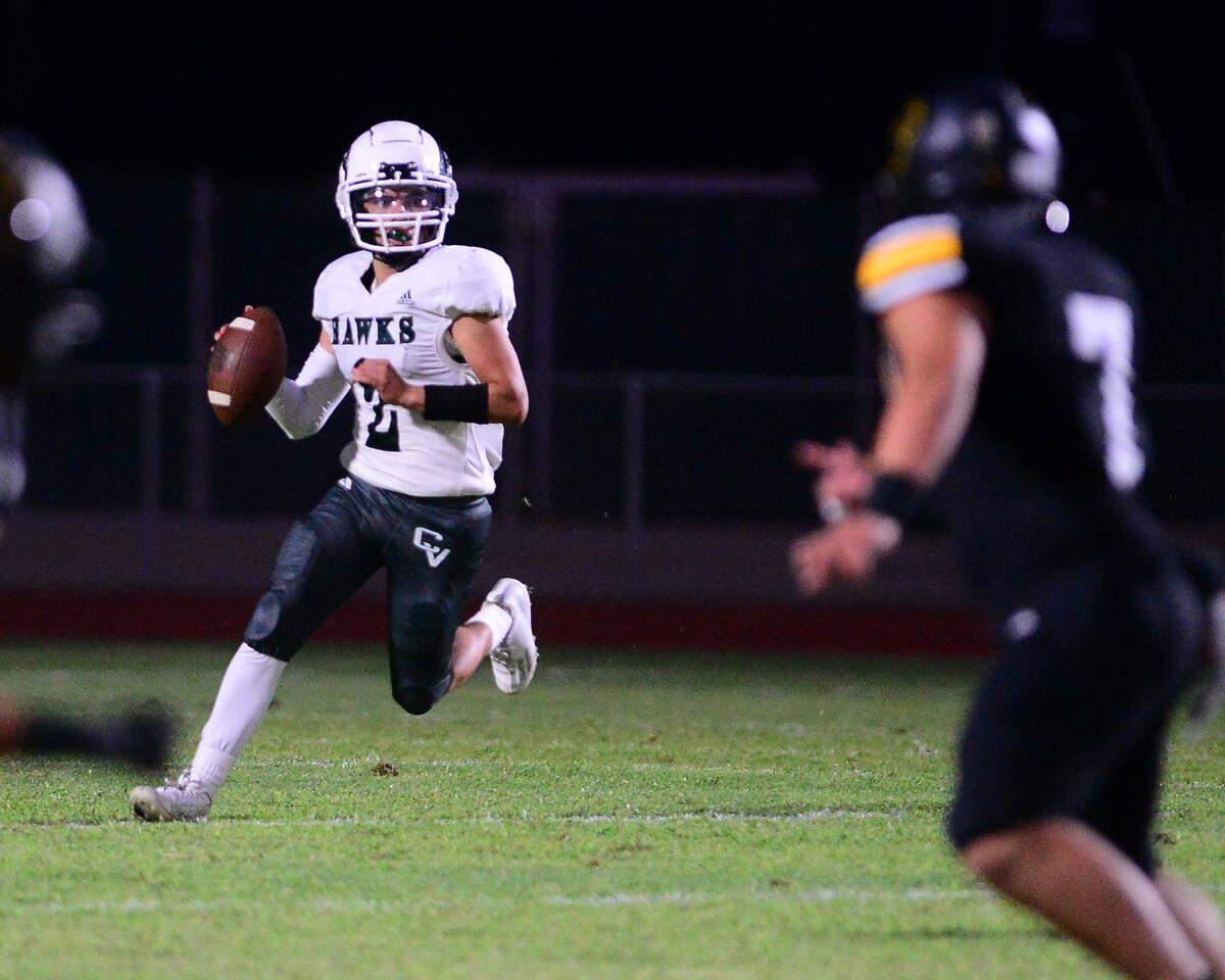 Central Valley quarterback Mario Gonzalez scrambles during a game between Hughson High School and Central Valley High School at Hughson High School in Hughson California on August 25, 2023.