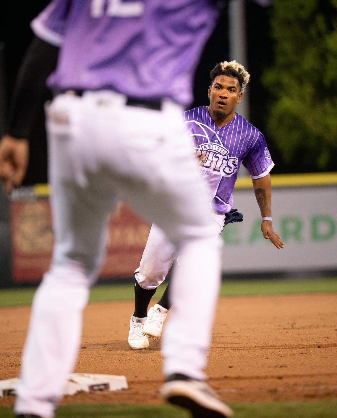 Modesto Nuts’ Ricardo Cova gets the green light and scores after an errant Giants pickoff attempt at second base during the opening night game with San Jose at John Thurman Field in Modesto, Friday, April 4, 2025.
