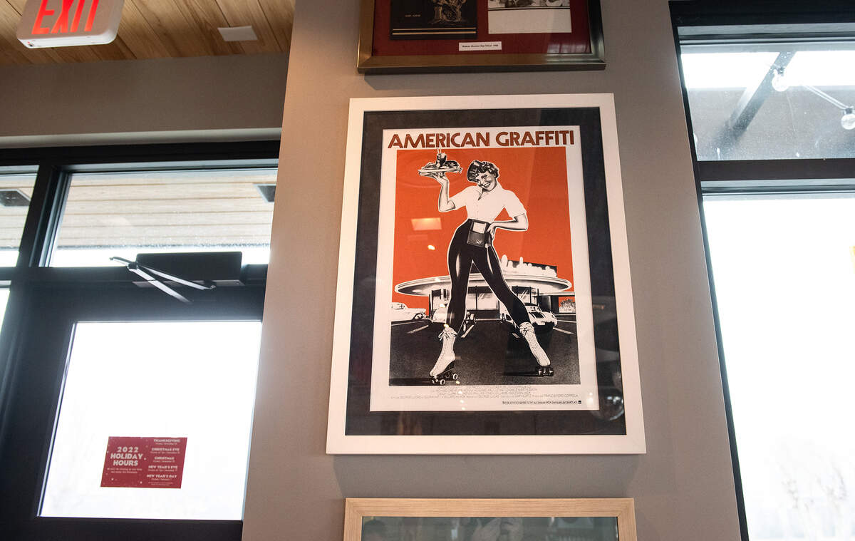 Memorabilia relating to Modesto history is displayed on the walls for the new Raising Cane’s Chicken Fingers restaurant in Modesto, Calif., Friday, Dec. 16, 2022.