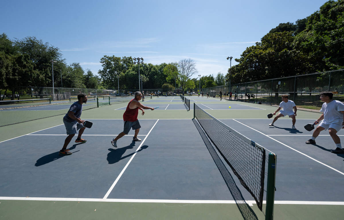 Jack Jacques, Steven Stewart, Chaise Havens and Mac Cabero play a game of pickleball at Graceada Park in Modesto, Calif., Saturday, July 22, 2023.