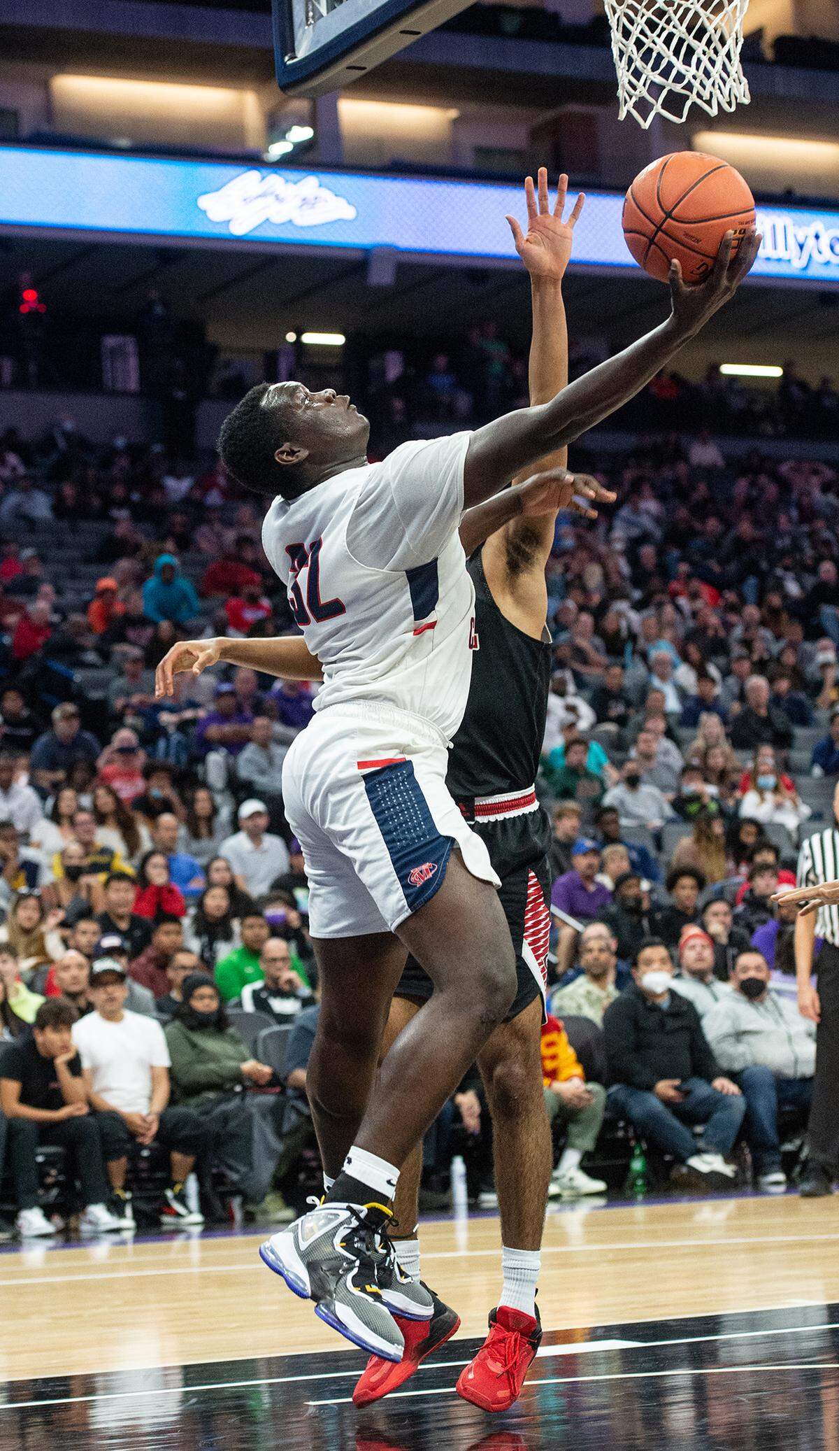 Modesto Christian’s Manasse Itete scores on a layup during the fourth quarter of the boys Open Division CIF State Basketball Championship game with Centennial at Golden 1 Center in Sacramento, Calif., on Saturday, March 12, 2022. Centennial won the game 59-50.