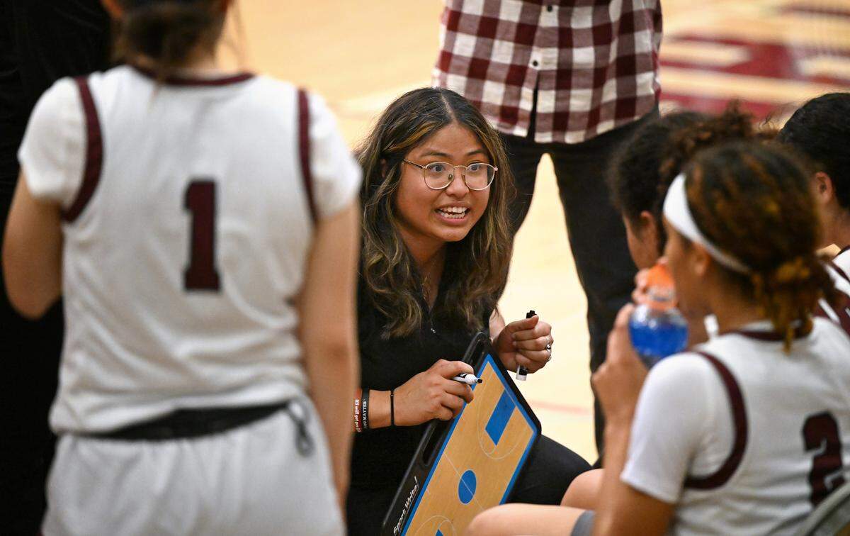 Riverbank coach Janelle Luu talks her players during a timeout in the CIF Northern California Division IV playoff game with Notre Dame at Riverbank High School in Riverbank, Calif., Thursday, Feb. 29, 2024.