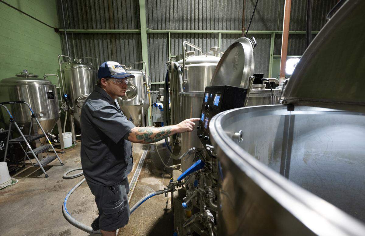 Brewmaster Bob Proffitt in the process of making beer at Track 424 Brewery in Modesto, Calif., Friday, June 28, 2024.