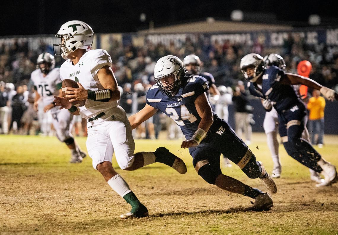 Tracy High quarterback Logan Fife rolls out and away from pressure in a CIF playoff game against Modesto Central Catholic. Fife signed with Fresno State on Wednesday, Dec. 18, 2019, the first day of the national early signing period.
