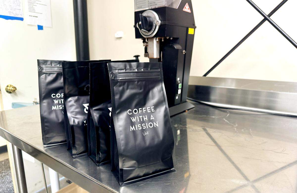 Coffee bags with the motto,“Coffee with a mission” are ready for sale at Volente Coffee Roasters in Modesto, Friday, Jan. 10, 2025.