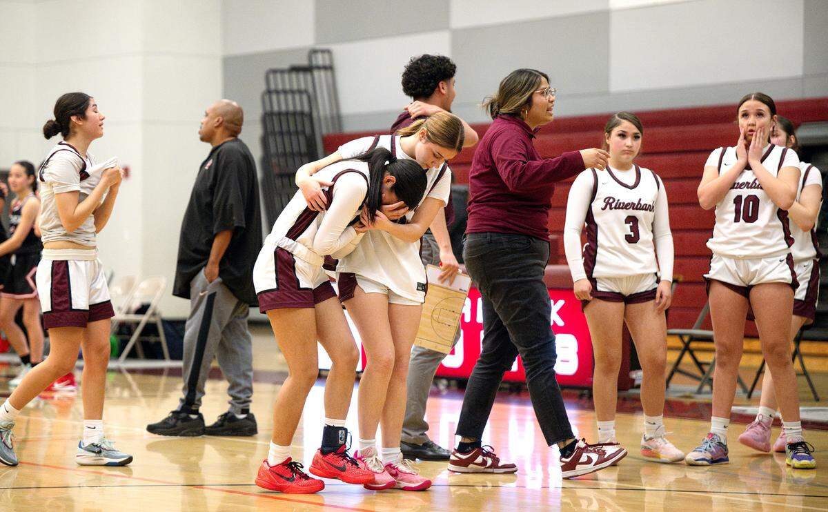 Riverbank players react to losing the first round Division 4 girls CIF NorCal playoff game with Castilleja (Palo Alto) in Riverbank Tuesday, March, 4, 2025. Castilleja won the game 44-43.
