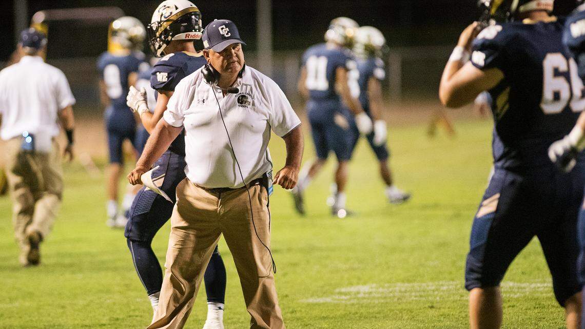 Central Catholic’s coach Roger Canepa talks to his defensive players during the Holy Bowl game with St. Mary’s at Central Catholic High School in Modesto , Calif., August 31, 2018.