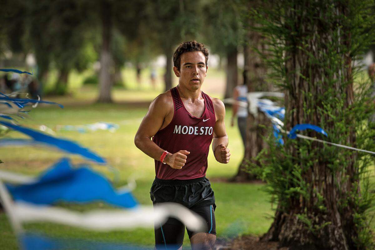 Modesto’s Fernando Alan Guerrero takes a large lead during the CCAL meet at Donnelly Park in Turlock, Calif., on Wednesday, Oct. 3, 2018. Guerrero finished first with a time of 15:46.