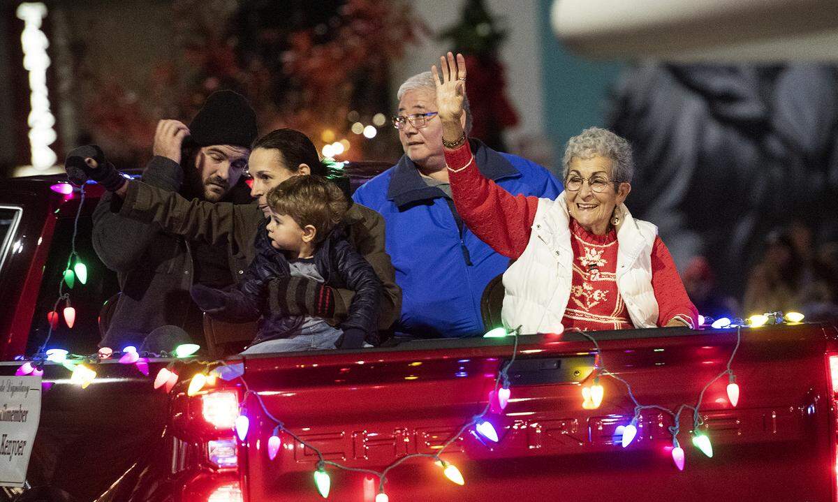 Modesto councilwoman Jenny Kenoyer waves to the crowd during the Celebration of Lights Parade in Modesto, Calif., Saturday, Dec. 7, 2019.