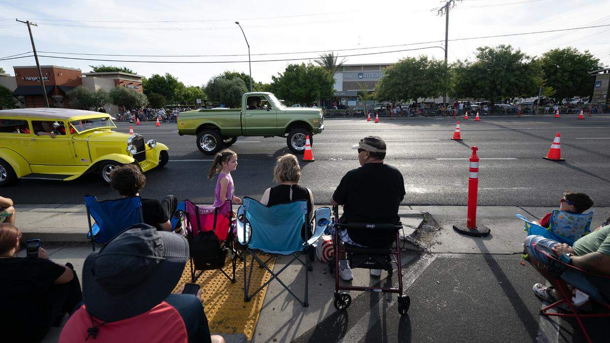 Hundreds of people lined McHenry Avenue to watch the classic car parade in Modesto, Calif., Friday, June 9, 2023. The Modesto metro area is the 19th most expensive place to live in the United States, according to U.S. News & World Report.