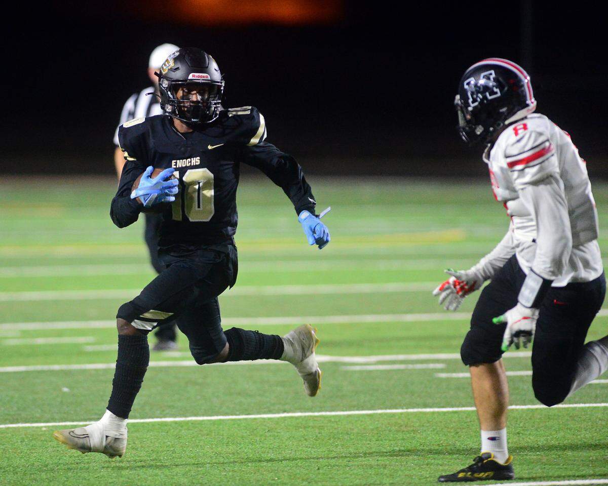 Enochs running back Aiden Muhammad (10) eyes a Modesto High defender during a game between Enochs High School and Modesto High School at Johansen High School in Modesto CA on October 28, 2022.