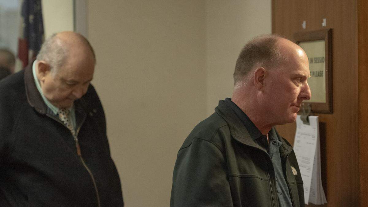 James Hooker, right, walks into Department 3 of Stanislaus County Superior Court alongside his attorney, Robert Chase, before a hearing in Modesto on May 4, 2026.