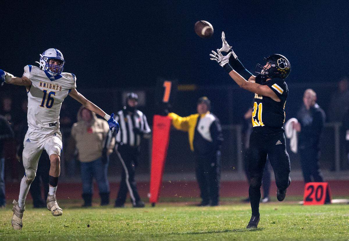 Hughson’s David Delgado gets past Ripon Christian’s Jace Beidleman to make a catch and run for a touchdown during the CIF Division 5-AA Northern California Regional Bowl Game on Friday, Dec. 2, 2022, in Hughson, Calif.