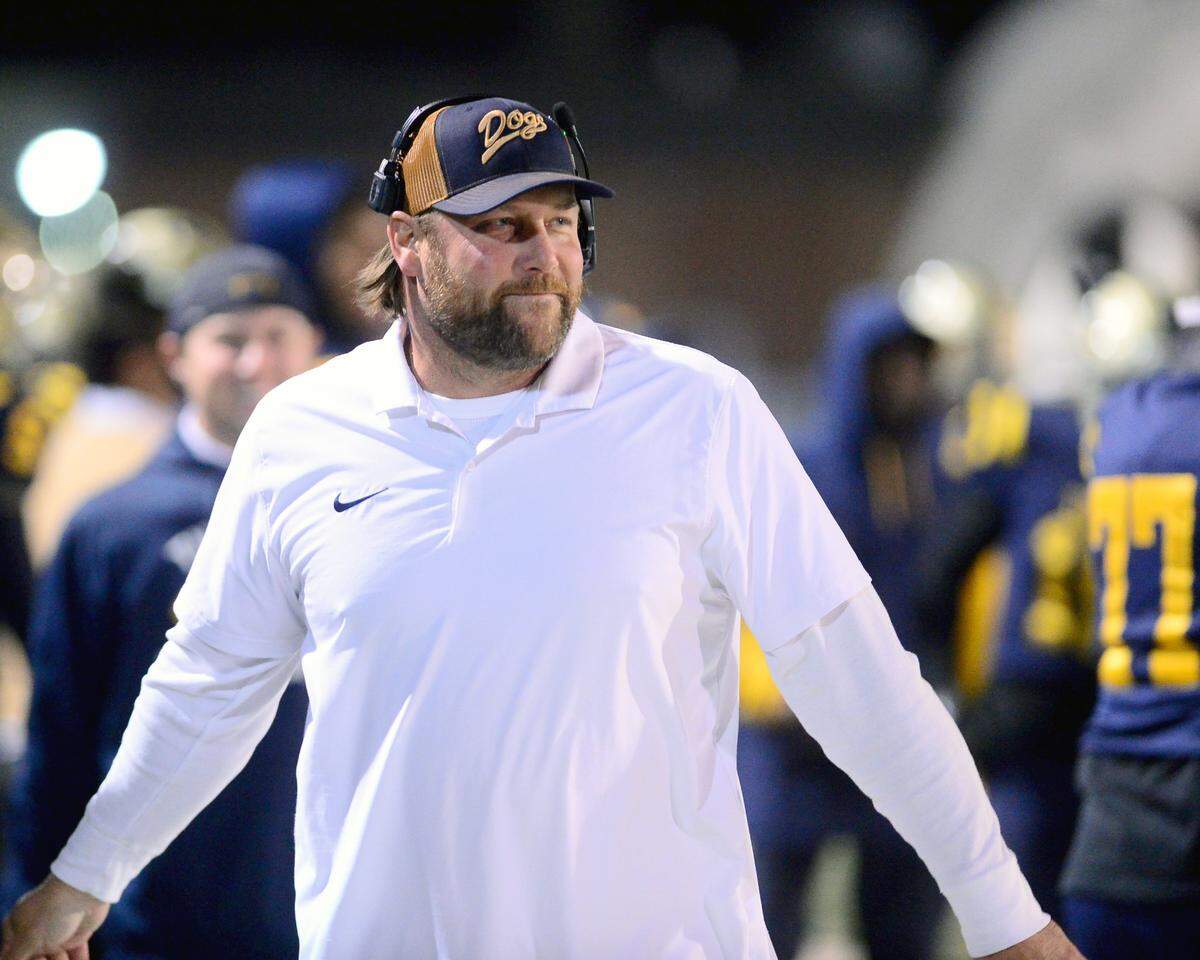 Turlock head coach James Peterson smiles after Turlock recovered an onside kick during a Division 1 CIF San-Joaquin Section playoff game between Turlock High School and Laguna Creek High School at Turlock High School in Turlock California on November 8, 2024. Turlock won the game 48-12.