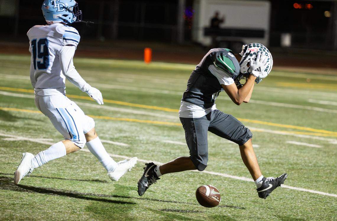Pitman’s Santiago Flores reacts to dropping a pass during the Central California Athletic League game with Downey at Turlock High School in Turlock, Friday, Oct. 10, 2025.