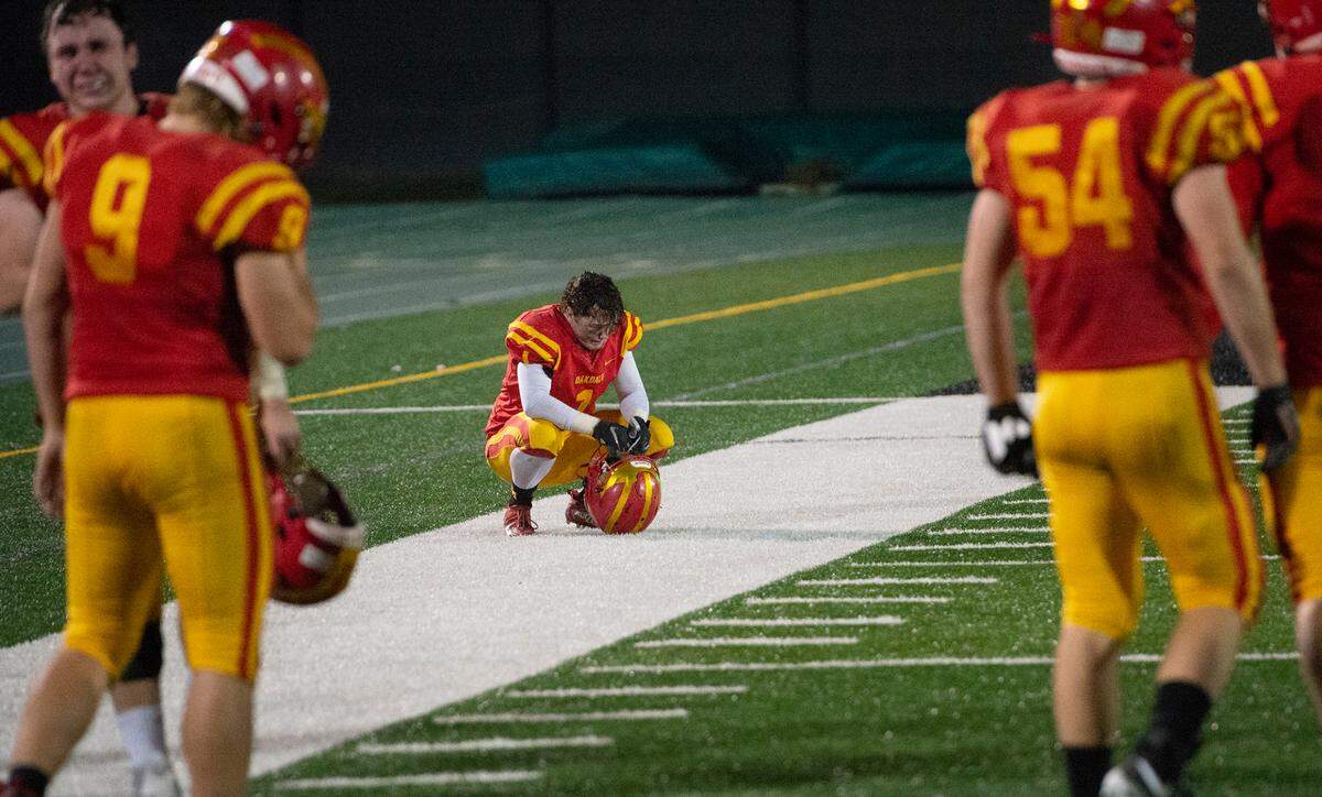 Oakdale players react after time runs out in the Sac-Joaquin Section Division III championship game with Manteca at St. Mary’s High School in Stockton, Calif., on Friday, Nov. 25, 2021. Manteca won the game 35-28.