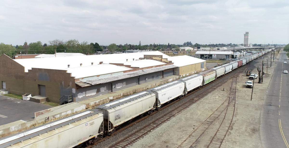 Freight train passes through downtown just north of F Street in Turlock, Calif., on Wednesday, March 30, 2022.