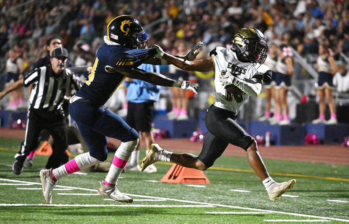 Gregori’s Reggieon Foster forces Enochs’ Eric Myles out of bounds after a catch and run in the Central California Athletic League game at Gregori High School in Modesto, Calif., Friday, Oct. 6, 2023. Gregori won the game 38-24.