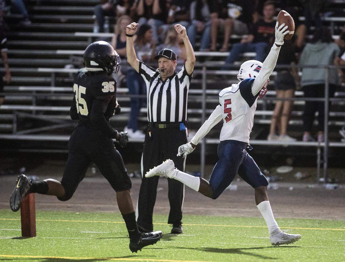 Beyer’s Darius Murphy scores a touchdown during the game with Enochs at Downey High School in Modesto, Calif., Friday, Aug. 23, 2019.