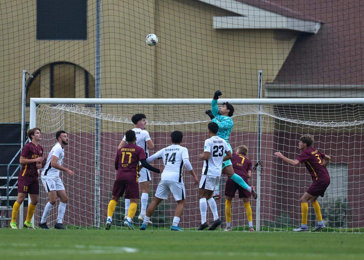 Nationally ranked No. 3 Stanislaus State men’s soccer goalkeeper Angel Ruiz-Hernandez jumps to deflect a long pass against No. 8 Midwestern State in the NCAA Division II Super Region IV Third Round at Warrior Stadium on Sunday, Nov. 30 at Warrior Stadium in Turlock, Calif.