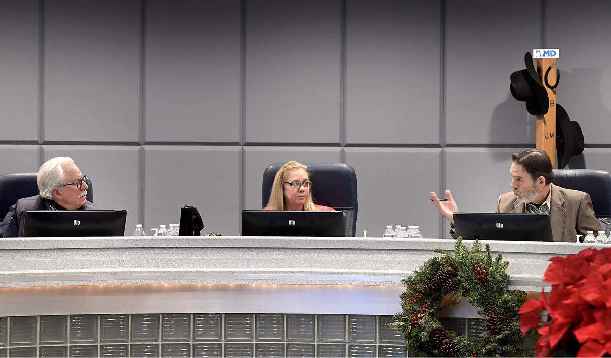 Board president Robert Frobose, right, and board members Larry Byrd, left, and Janice Keating, middle, during the Modesto Irrigation District board meeting in Modesto, Tuesday, Dec. 16, 2025.  