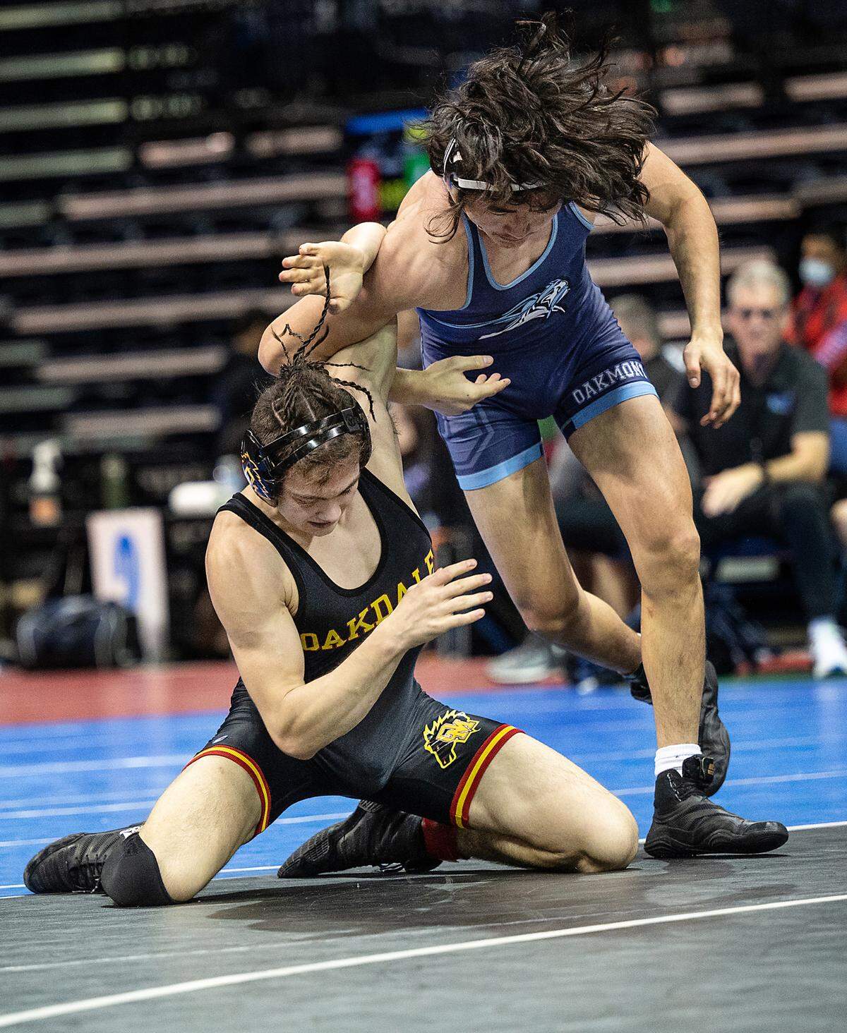 Payne Perkins of Oakdale, left, and Henry Ganzorig of Oakmont grapple in the 152-pound third-place match during the CIF Sac-Joaquin Section Masters Wrestling Tournament at the Stockton Arena in Stockton, Calif., on Saturday, Feb. 19, 2022. Perkins won 1-0 for third place.